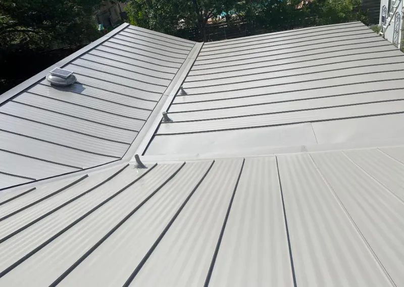 Solar attic fan installed on a metal roof for Roof Ventilation in Oakmont